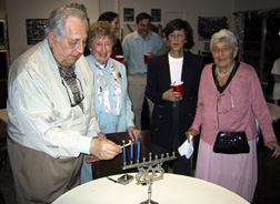 Sid lights the menorah