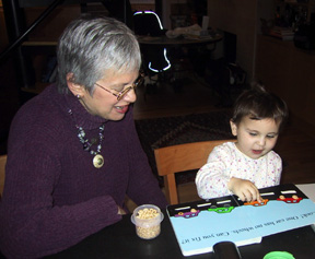 Bobbe and Josie with Cheerios book