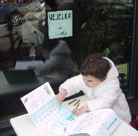 Josie coloring outside Veselka