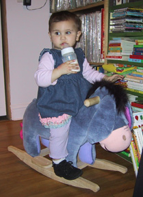 Josie riding Eeyore